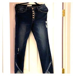 Dark wash, step hem, exposed button fly jeans